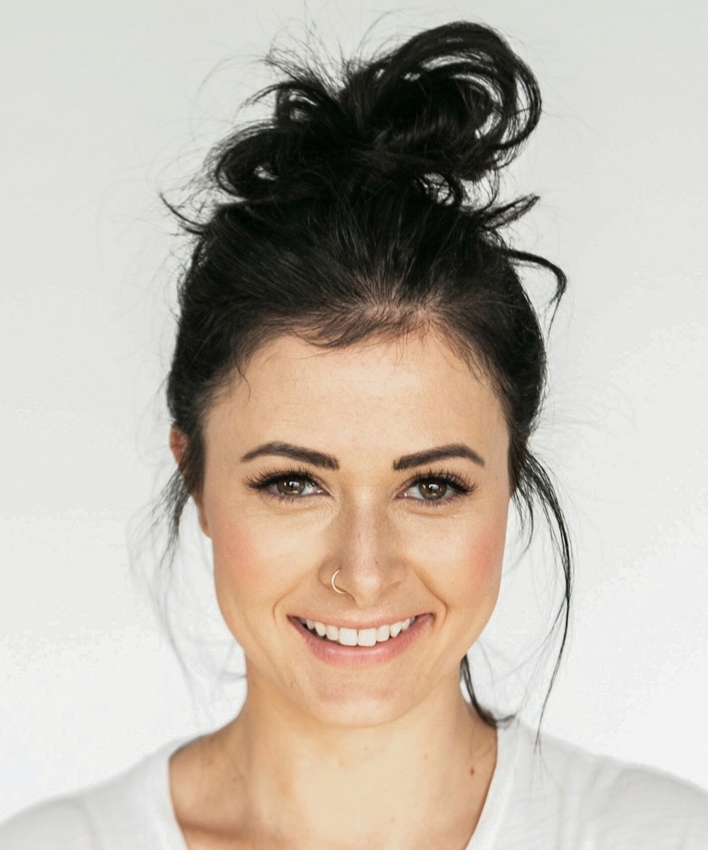 Photo by Jake Nackos woman in white crew neck shirt smiling